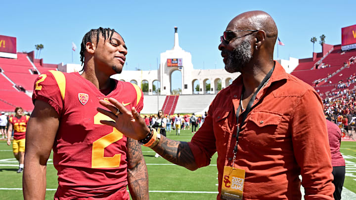 USC wide receiver Brenden Rice (L) alongside his father, San Francisco 49ers Hall of Famer Jerry Rice (R)