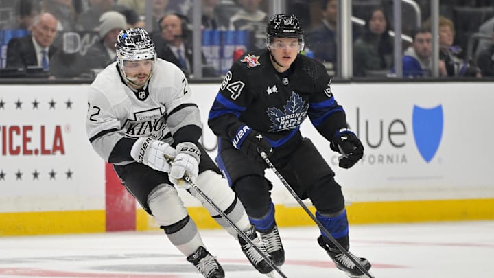 Jan 2, 2024; Los Angeles, California, USA; Los Angeles Kings left wing Kevin Fiala (22) skates the puck past Toronto Maple Leafs center David Kampf (64) in the second period at Crypto.com Arena. Mandatory Credit: Jayne Kamin-Oncea-Imagn Images Jan 2, 2024; Los Angeles, California, USA; Los Angeles Kings left wing Kevin Fiala (22) skates the puck past Toronto Maple Leafs center David Kampf (64) in the second period at Crypto.com Arena. Mandatory Credit: Jayne Kamin-Oncea-Imagn Images