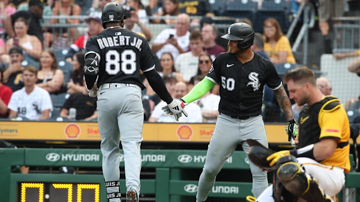 Jul 18, 2025; Pittsburgh, Pennsylvania, USA;  Chicago White Sox second baseman Lenyn Sosa (50) greets center fielder Luis Robert Jr. (88) returning to the dugout with a solo home run against the Pittsburgh Pirates during the fourth inning at PNC Park. Mandatory Credit: Charles LeClaire-Imagn Images