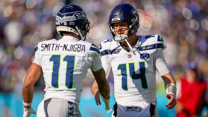 Seattle Seahawks wide receiver Jaxon Smith-Njigba (11) celebrates his touchdown with quarterback Sam Darnold (14) during the second quarter against the Tennessee Titans at Nissan Stadium in Nashville, Tenn., Sunday, Nov. 23, 2025.