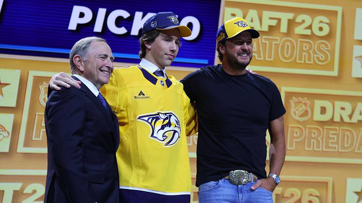 Jun 26, 2026; Buffalo, New York, USA; Wyatt Cullen reacts beside NHL commissioner Gary Bettman and country singer Luke Bryan after being selected with the tenth pick in the first round of the 2026 NHL Draft by the Nashville Predators at KeyBank Center. Mandatory Credit: Timothy T. Ludwig-Imagn Images