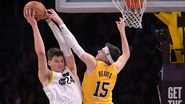 Los Angeles Lakers guard Austin Reaves (15) defends a shot by Utah Jazz center Walker Kessler (24) in the second half at Crypto.com Arena.