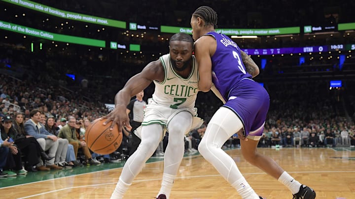Nov 3, 2025; Boston, Massachusetts, USA; Boston Celtics guard Jaylen Brown (7) controls the ball while Utah Jazz guard Keyonte George (3) defends during the first half at TD Garden. Mandatory Credit: Bob DeChiara-Imagn Images