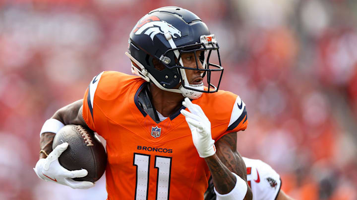 Sep 22, 2024; Tampa, Florida, USA; Denver Broncos wide receiver Josh Reynolds (11) makes a catch against the Tampa Bay Buccaneers in the first quarter at Raymond James Stadium. Mandatory Credit: Nathan Ray Seebeck-Imagn Images