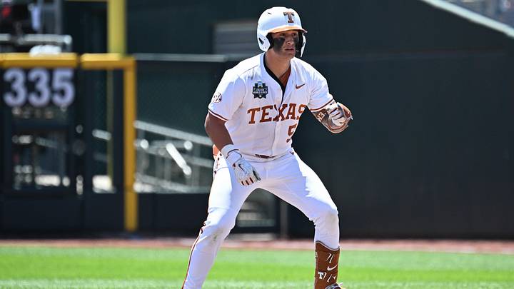 Texas Longhorns infielder Ethan Mendoza at second base after a double against the Alabama Crimson Tide in the Men's College World Series. Texas Longhorns infielder Ethan Mendoza at second base after a double against the Alabama Crimson Tide in the Men's College World Series.