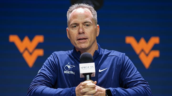 Oct 22, 2024; Kansas City, MO, USA; West Virginia Mountaineers head coach Mark Kellogg talks to media during Big 12 Women’s Basketball Media Day at T-Mobile Center. Mandatory Credit: Jay Biggerstaff-Imagn Images
