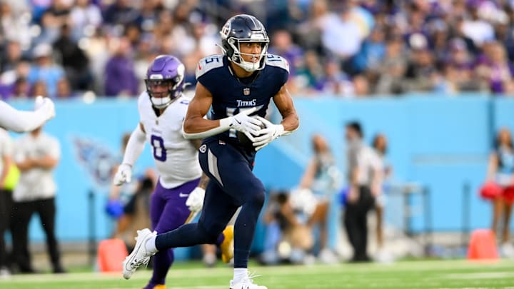 Nov 17, 2024; Nashville, Tennessee, USA;  Tennessee Titans wide receiver Nick Westbrook-Ikhine (15) runs with the ball after a made catch against the Minnesota Vikings during the second half at Nissan Stadium.
