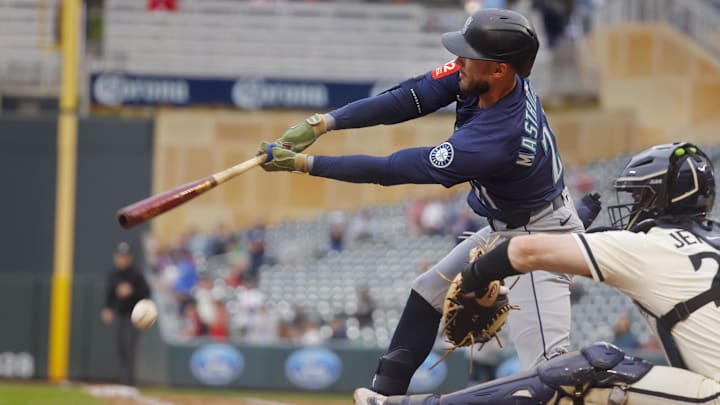 Seattle Mariners pinch hitter Miles Mastrobuoni hits a single against the Minnesota Twins on June 26 at Target Field. Seattle Mariners pinch hitter Miles Mastrobuoni hits a single against the Minnesota Twins on June 26 at Target Field.