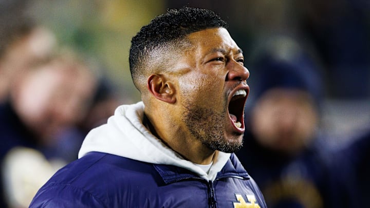 Notre Dame coach Marcus Freeman celebrates after winning the College Football Playoff first-round game over Indiana.