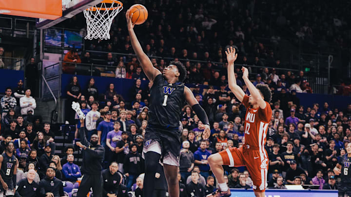 Great Osobor is shown driving to the hoop against Washington State.