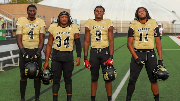 Warren Central Damien Shanklin (4), Warren Central Marcus Bell Jr. (34), Warren Central Tyrone Burrus Jr. (9), and Warren Central Jerimy Finch Jr. (11) take a minute for a photo as they start their warm up drills as Ben Davis took on Warren Central High School in IHSAA football, Sep 20, 2024; Indianapolis, IN, USA; at Warren Central High School.