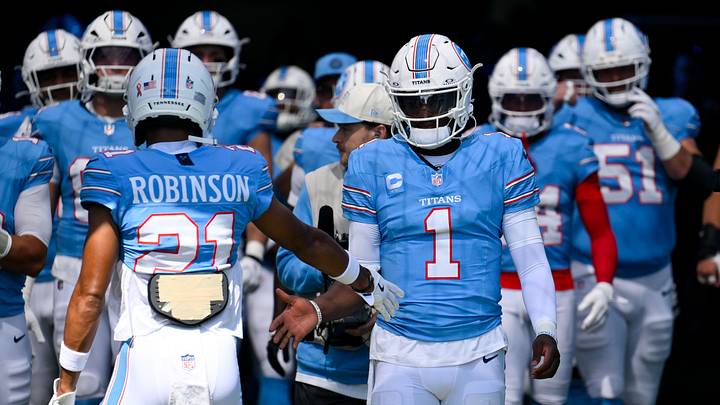 Sep 13, 2026; Nashville, Tennessee, USA; Tennessee Titans quarterback Cam Ward (1) and cornerback Micah Robinson (21) get ready to take the field against the New York Jets during pre-game warmups at Nissan Stadium. Mandatory Credit: Steve Roberts-Imagn Images Sep 13, 2026; Nashville, Tennessee, USA; Tennessee Titans quarterback Cam Ward (1) and cornerback Micah Robinson (21) get ready to take the field against the New York Jets during pre-game warmups at Nissan Stadium. Mandatory Credit: Steve Roberts-Imagn Images