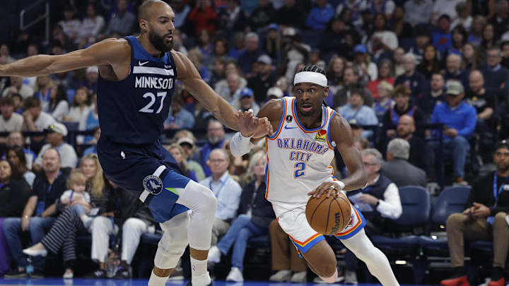 Mar 15, 2026; Oklahoma City, Oklahoma, USA; Oklahoma City Thunder guard Shai Gilgeous-Alexander (2) drives around Minnesota Timberwolves center Rudy Gobert (27) during the first half at Paycom Center. Mar 15, 2026; Oklahoma City, Oklahoma, USA; Oklahoma City Thunder guard Shai Gilgeous-Alexander (2) drives around Minnesota Timberwolves center Rudy Gobert (27) during the first half at Paycom Center.