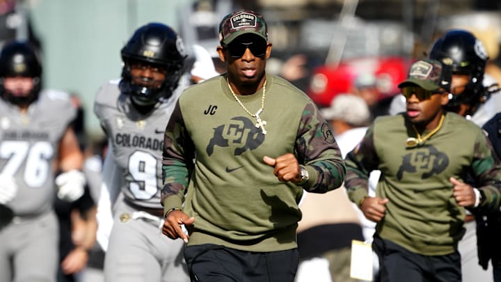 Nov 11, 2023; Boulder, Colorado, USA; Colorado Buffaloes head coach Deion Sanders runs on to the field before the first half against the Arizona Wildcats at Folsom Field. Mandatory Credit: Ron Chenoy-Imagn Images