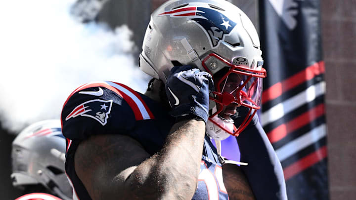 New England Patriots linebacker Anfernee Jennings runs onto the field before a game against the Carolina Panthers.