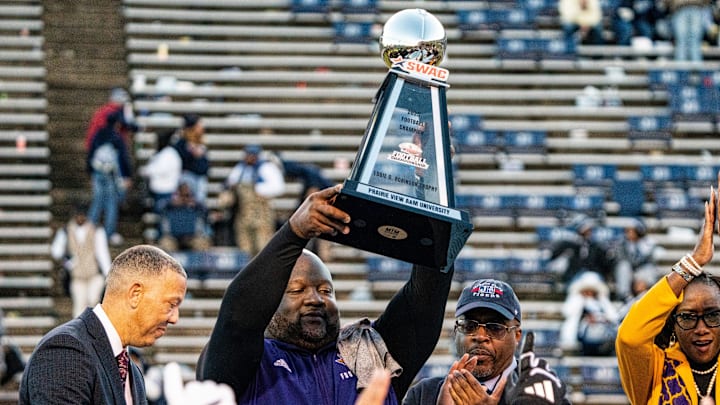 Prairie View A&M head coach Tremaine Jackson raises Eddie G. Robinson Trophy after the SWAC football championship game between Jackson State and Prairie View A&M at Mississippi Veterans Memorial Stadium in Jackson, Miss., on Saturday, Dec. 6, 2025. Prairie View A&M defeated Jackson State 23-21. Prairie View A&M head coach Tremaine Jackson raises Eddie G. Robinson Trophy after the SWAC football championship game between Jackson State and Prairie View A&M at Mississippi Veterans Memorial Stadium in Jackson, Miss., on Saturday, Dec. 6, 2025. Prairie View A&M defeated Jackson State 23-21.