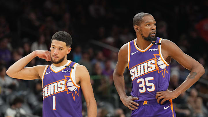 Nov 27, 2024; Phoenix, Arizona, USA; Phoenix Suns guard Devin Booker (1) and Phoenix Suns forward Kevin Durant (35) look on against the Brooklyn Nets during the second half at Footprint Center. Mandatory Credit: Joe Camporeale-Imagn Images Nov 27, 2024; Phoenix, Arizona, USA; Phoenix Suns guard Devin Booker (1) and Phoenix Suns forward Kevin Durant (35) look on against the Brooklyn Nets during the second half at Footprint Center. Mandatory Credit: Joe Camporeale-Imagn Images