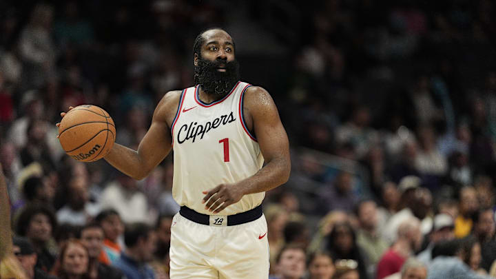 Jan 31, 2025; Charlotte, North Carolina, USA; LA Clippers guard James Harden (1) handles the ball against the Charlotte Hornets during the second half at Spectrum Center. Mandatory Credit: Jim Dedmon-Imagn Images