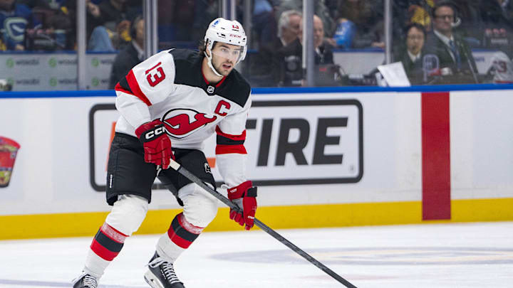 Oct 30, 2024; Vancouver, British Columbia, CAN; New Jersey Devils forward Nico Hischier (13) skates against the Vancouver Canucks during the first period at Rogers Arena. Mandatory Credit: Bob Frid-Imagn Images