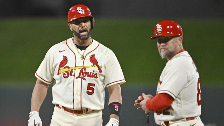 Oct 8, 2022; St. Louis, Missouri, USA; St. Louis Cardinals designated hitter Albert Pujols (5) reacts after his single in the eighth inning against the Philadelphia Phillies during game two of the Wild Card series for the 2022 MLB Playoffs at Busch Stadium. Mandatory Credit: Jeff Curry-Imagn Images