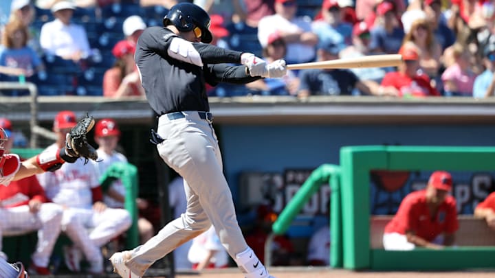 Mar 19, 2025; Clearwater, Florida, USA;  New York Yankees outfielder Cody Bellinger (35) hits a home run ]during the sixth inning against the Philadelphia Phillies  at BayCare Ballpark. 