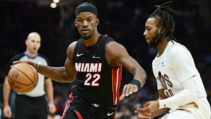 Nov 22, 2023; Cleveland, Ohio, USA; Miami Heat forward Jimmy Butler (22) drives to the basket against Cleveland Cavaliers guard Darius Garland (10) during the first half at Rocket Mortgage FieldHouse. Mandatory Credit: Ken Blaze-Imagn Images