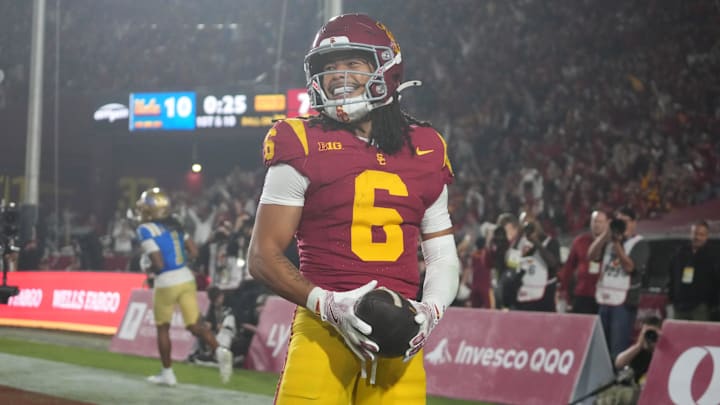 Nov 29, 2025; Los Angeles, California, USA; Southern California Trojans wide receiver Makai Lemon (6) celebrates after catching a 32-yard touchdown pass against the UCLA Bruins in the second half at United Airlines Field at Los Angeles Memorial Coliseum. Mandatory Credit: Kirby Lee-Imagn Images