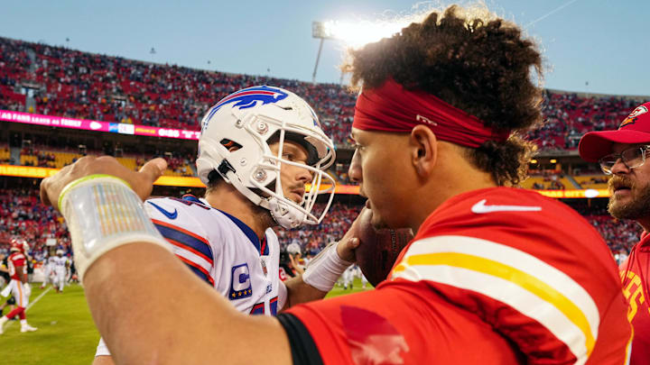 Buffalo Bills quarterback Josh Allen (17) hugs Kansas City Chiefs quarterback Patrick Mahomes (15) after a game at GEHA Field at Arrowhead Stadium.
