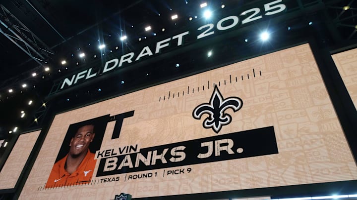 Apr 24, 2025; Green Bay, WI, USA; Texas Longhorns tackle Kelvin Banks is selected as the No. 9 pick by the New Orleans Saints during the NFL Draft at Lambeau Field. Mandatory Credit: Kirby Lee-Imagn Images Apr 24, 2025; Green Bay, WI, USA; Texas Longhorns tackle Kelvin Banks is selected as the No. 9 pick by the New Orleans Saints during the NFL Draft at Lambeau Field. Mandatory Credit: Kirby Lee-Imagn Images