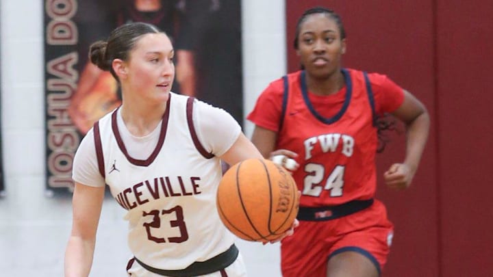 Niceville’s Carson Fayard moves the ball up court during the Niceville Fort Walton Beach girls basketball game at Niceville. The Lady Vikings won 54-51.