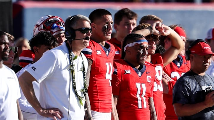 Oct 19, 2024; Tucson, Arizona, USA; Arizona Wildcats head coach Brent Brennan, wide receiver Tetairoa McMillan (4), and quarterback Noah Fifita (11) look on during the fourth quarter against the Colorado Buffaloes at Arizona Stadium. 