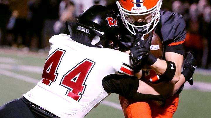 Blackman's James Stevenson (9) carries the ball as Maryville's linebacker Wyatt Wilber (44) makes the stop during the football playoff game on Friday, Nov. 21, 2025, at Blackman.
