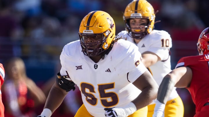 Nov 30, 2024; Tucson, Arizona, USA; Arizona State Sun Devils offensive lineman Josh Atkins (65) against the Arizona Wildcats during the Territorial Cup at Arizona Stadium. Mandatory Credit: Mark J. Rebilas-Imagn Images