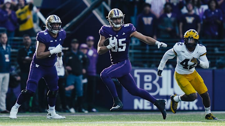 Tight end Keleki Latu finds room to run against Michigan with one of his 7 catches.