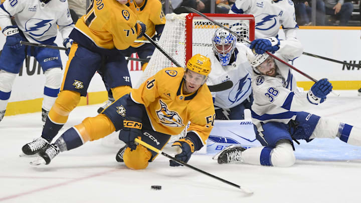 Oct 28, 2025; Nashville, Tennessee, USA;  Nashville Predators left wing Erik Haula (56) and Tampa Bay Lightning left wing Brandon Hagel (38) battle for the puck during the third period at Bridgestone Arena. Mandatory Credit: Steve Roberts-Imagn Images Oct 28, 2025; Nashville, Tennessee, USA;  Nashville Predators left wing Erik Haula (56) and Tampa Bay Lightning left wing Brandon Hagel (38) battle for the puck during the third period at Bridgestone Arena. Mandatory Credit: Steve Roberts-Imagn Images