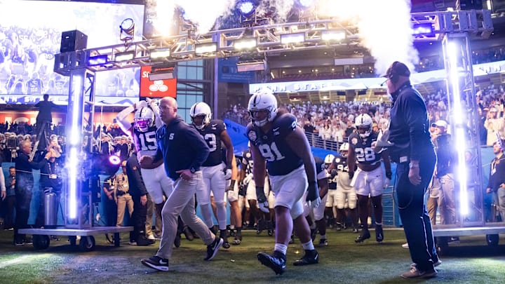 Penn State football head coach James Franklin leading Nittany Lions onto the field
