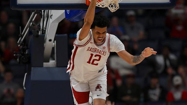 Mar 14, 2026; Nashville, TN, USA; Arkansas Razorbacks forward Malique Ewin (12) celebrates his dunk against the Mississippi Rebels during the second half at Bridgestone Arena. Mandatory Credit: Steve Roberts-Imagn Images Mar 14, 2026; Nashville, TN, USA; Arkansas Razorbacks forward Malique Ewin (12) celebrates his dunk against the Mississippi Rebels during the second half at Bridgestone Arena. Mandatory Credit: Steve Roberts-Imagn Images