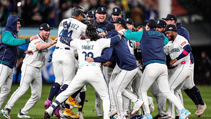 Seattle Mariners players celebrate 3-2 win over Detroit Tigers after 15 innings at ALDS Game 5 at T-Mobile Park in Seattle on Friday, Oct. 10, 2025.