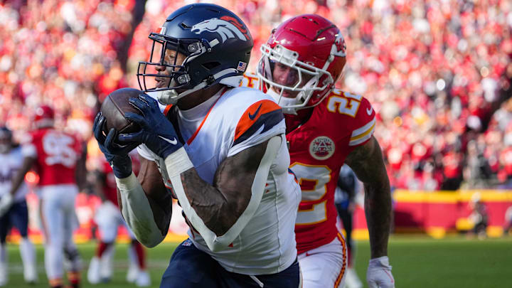 Nov 10, 2024; Kansas City, Missouri, USA; Denver Broncos wide receiver Courtland Sutton (14) catches a pass for a touchdown as Kansas City Chiefs linebacker Drue Tranquill (23) chases during the first half at GEHA Field at Arrowhead Stadium. Nov 10, 2024; Kansas City, Missouri, USA; Denver Broncos wide receiver Courtland Sutton (14) catches a pass for a touchdown as Kansas City Chiefs linebacker Drue Tranquill (23) chases during the first half at GEHA Field at Arrowhead Stadium.