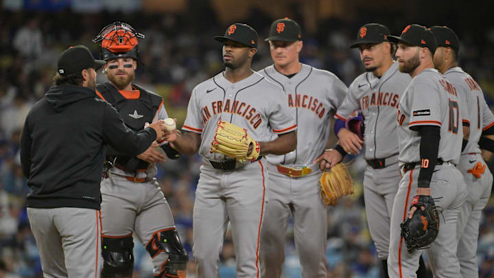 May 12, 2026; Los Angeles, California, USA; San Francisco Giants pitcher Joel Peguero (63) hands the ball to manager Tony Vitello (23) for a pitching change against the Los Angeles Dodgers during the seventh inning at Dodger Stadium. Mandatory Credit: Jayne Kamin-Oncea-Imagn Images May 12, 2026; Los Angeles, California, USA; San Francisco Giants pitcher Joel Peguero (63) hands the ball to manager Tony Vitello (23) for a pitching change against the Los Angeles Dodgers during the seventh inning at Dodger Stadium. Mandatory Credit: Jayne Kamin-Oncea-Imagn Images