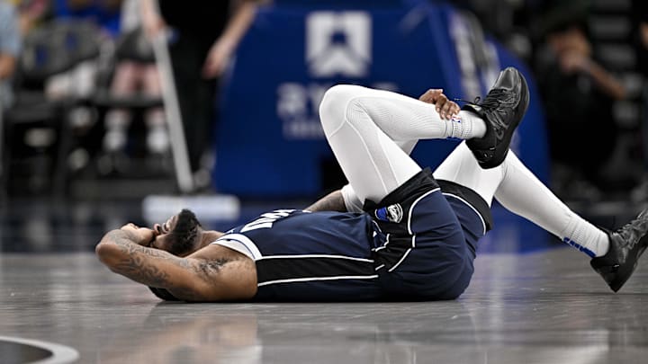 Mar 3, 2025; Dallas, Texas, USA; Dallas Mavericks guard Jaden Hardy (1) grabs his leg after suffering an apparent injury during the second half against the Sacramento Kings at the American Airlines Center. Mandatory Credit: Jerome Miron-Imagn Images