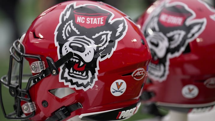 Dec 30, 2022; Charlotte, NC, USA; North Carolina State Wolfpack helmets during the first half against the Maryland Terrapins in the 2022 Duke's Mayo Bowl at Bank of America Stadium. Mandatory Credit: Jim Dedmon-Imagn Images