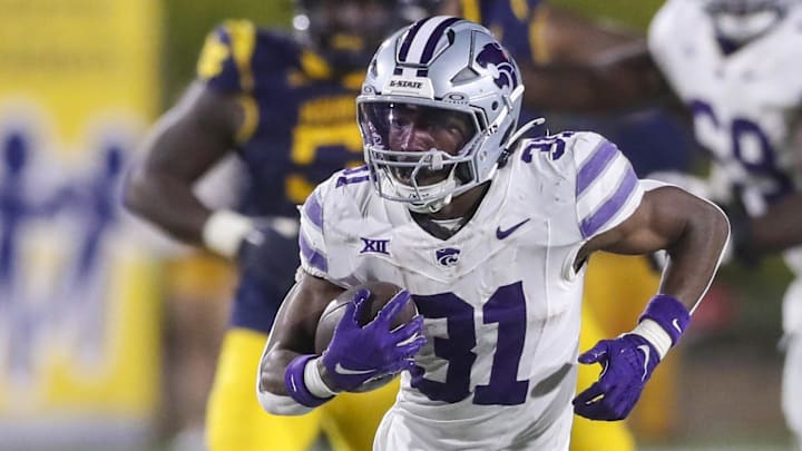 Kansas State Wildcats running back DJ Giddens (31) runs after a catch during the third quarter against the West Virginia Mountaineers at Mountaineer Field at Milan Puskar Stadium.