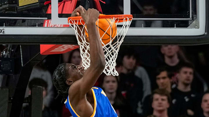 West Virginia Mountaineers center Eduardo Andre (0) dunks in the first half of the NCAA basketball game between the Cincinnati Bearcats and the West Virginia Mountaineers at Fifth Third Arena in Cincinnati on Sunday, Feb. 2, 2025. West Virginia Mountaineers center Eduardo Andre (0) dunks in the first half of the NCAA basketball game between the Cincinnati Bearcats and the West Virginia Mountaineers at Fifth Third Arena in Cincinnati on Sunday, Feb. 2, 2025.