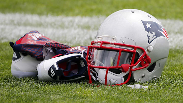 Jul 30, 2015; Foxborough, MA, USA; A New England Patriots helmet, shoes and gloves sit on the field during training camp at Gillette Stadium. Mandatory Credit: Winslow Townson-Imagn Images