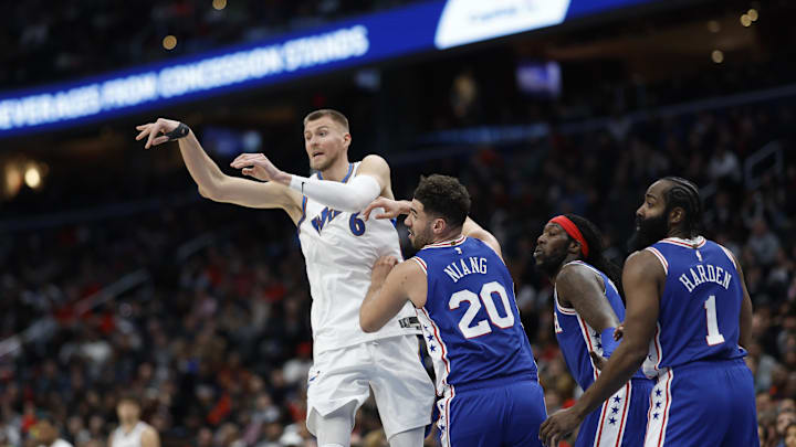 Dec 27, 2022; Washington, District of Columbia, USA; Washington Wizards center Kristaps Porzingis (6) passes the ball as Philadelphia 76ers forward Georges Niang (20) defends in the third quarter at Capital One Arena. Mandatory Credit: Geoff Burke-Imagn Images Dec 27, 2022; Washington, District of Columbia, USA; Washington Wizards center Kristaps Porzingis (6) passes the ball as Philadelphia 76ers forward Georges Niang (20) defends in the third quarter at Capital One Arena. Mandatory Credit: Geoff Burke-Imagn Images