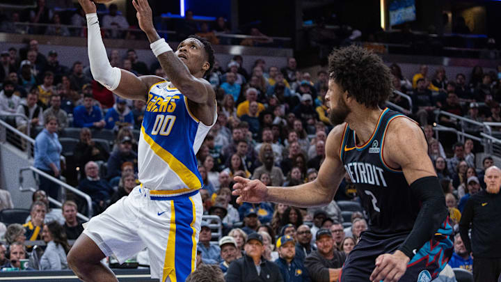 Nov 24, 2025; Indianapolis, Indiana, USA; Indiana Pacers guard Bennedict Mathurin (00) shoots the ball while Detroit Pistons guard Cade Cunningham (2) defends in the first half at Gainbridge Fieldhouse. Mandatory Credit: Trevor Ruszkowski-Imagn Images