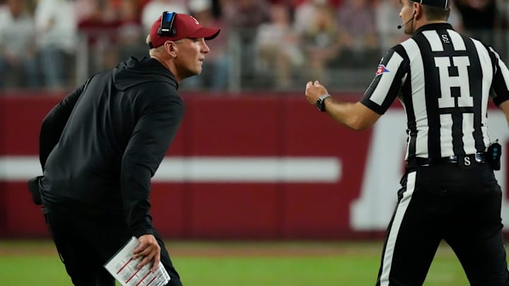 Sep 6, 2025; Tuscaloosa, Alabama, USA; Alabama head coach Kalen DeBoer gets the penalty on his offense from an official during the game with UL Monroe at Saban Field at Bryant-Denny Stadium. Mandatory Credit: Gary Cosby Jr.-Imagn Images