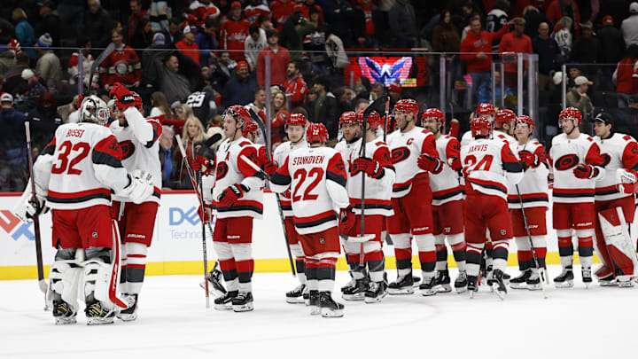 Dec 11, 2025; Washington, District of Columbia, USA; Carolina Hurricanes goaltender Brandon Bussi (32) celebrates with teammates after their game against the Washington Capitals at Capital One Arena. Mandatory Credit: Geoff Burke-Imagn Images Dec 11, 2025; Washington, District of Columbia, USA; Carolina Hurricanes goaltender Brandon Bussi (32) celebrates with teammates after their game against the Washington Capitals at Capital One Arena. Mandatory Credit: Geoff Burke-Imagn Images