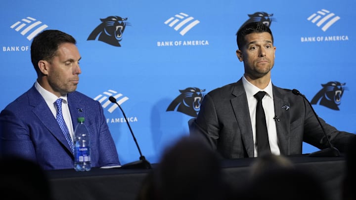 Feb 1, 2024; Charlotte, NC, USA;  Carolina Panthers head coach Dave Canales speaks to the media as general manager Dan Morgan looks on during the introductory press conference at Bank of America Stadium. Mandatory Credit: Jim Dedmon-USA TODAY Sports
